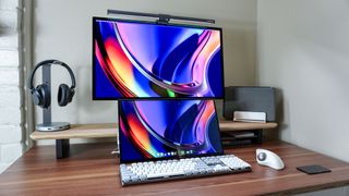 A dual-monitor desk setup powered by the Mac mini M4 with the Satechi SM3 mechanical keyboard in the foreground