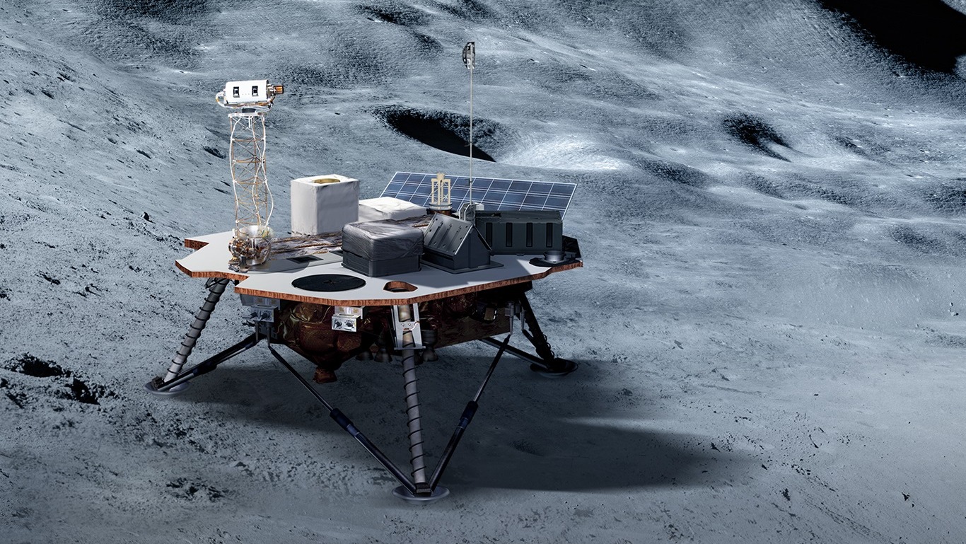 lander on the moon's surface with four legs and payloads on top