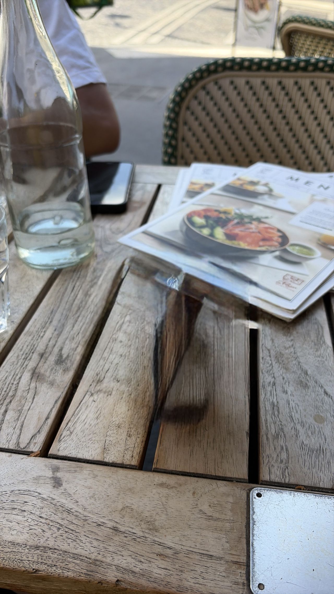 A photo of a coffee cup on a wooden table edited with Clean Up in iOS 27