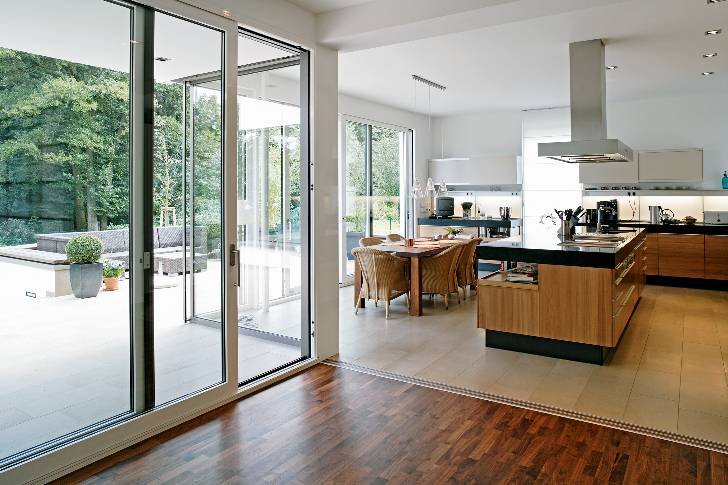 Schueco ASE 60 sliding door system with white frame