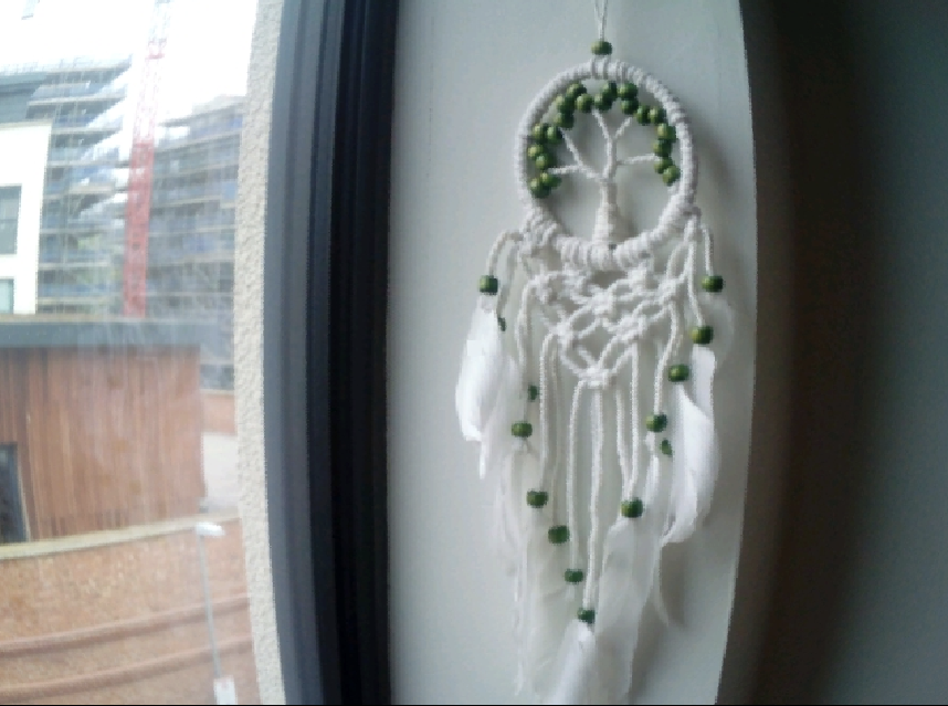 A photo of a dreamcatcher with a fisheye effect applied, taken on a myFirst Camera 50 smartphone camera for 5-12-year-olds