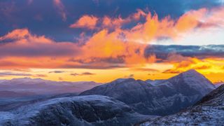 Mountain scene with backlit clouds