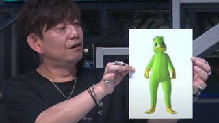 Final Fantasy 14's Naoki Yoshida holds up a picture of the MMO's upcoming kappa suit