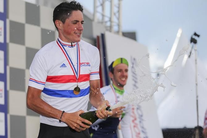 Peter Kennaugh , Team Sky lets loose on the podium.