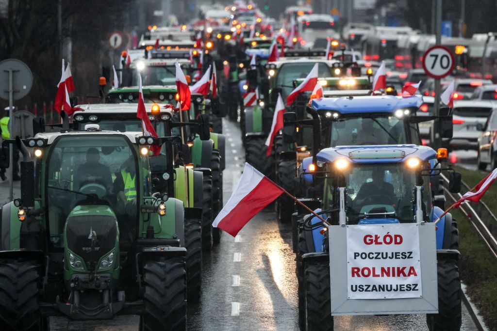 Farmers enter Krakow, Poland, in tractors with Polish national flags during the nationwide farmers&#039; strike on February 20, 2024. The protest is part of the European farmers&#039; protest against the EU Green Deal regulations. Polish farmers also demand a change to the EU agreement with Ukraine regarding the import of agricultural produce to the EU.