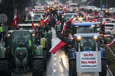 Farmers enter Krakow, Poland, in tractors with Polish national flags during the nationwide farmers' strike on February 20, 2024. The protest is part of the European farmers' protest against the EU Green Deal regulations. Polish farmers also demand a change to the EU agreement with Ukraine regarding the import of agricultural produce to the EU.