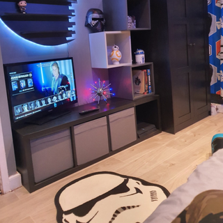 childrens bedroom with star wars theme and wooden flooring