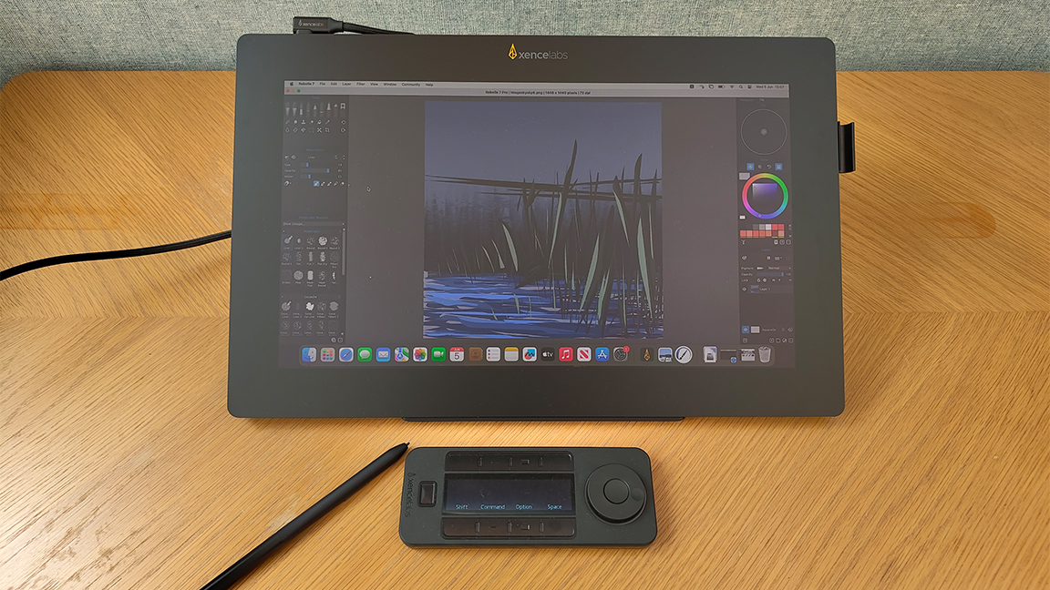 Xencelabs Pen Display 16 review; a pen display on a wooden desk