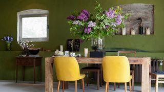 A stylish dining room with green accents