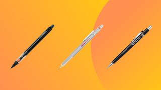 three mechanical pencils on an angle on an orange background