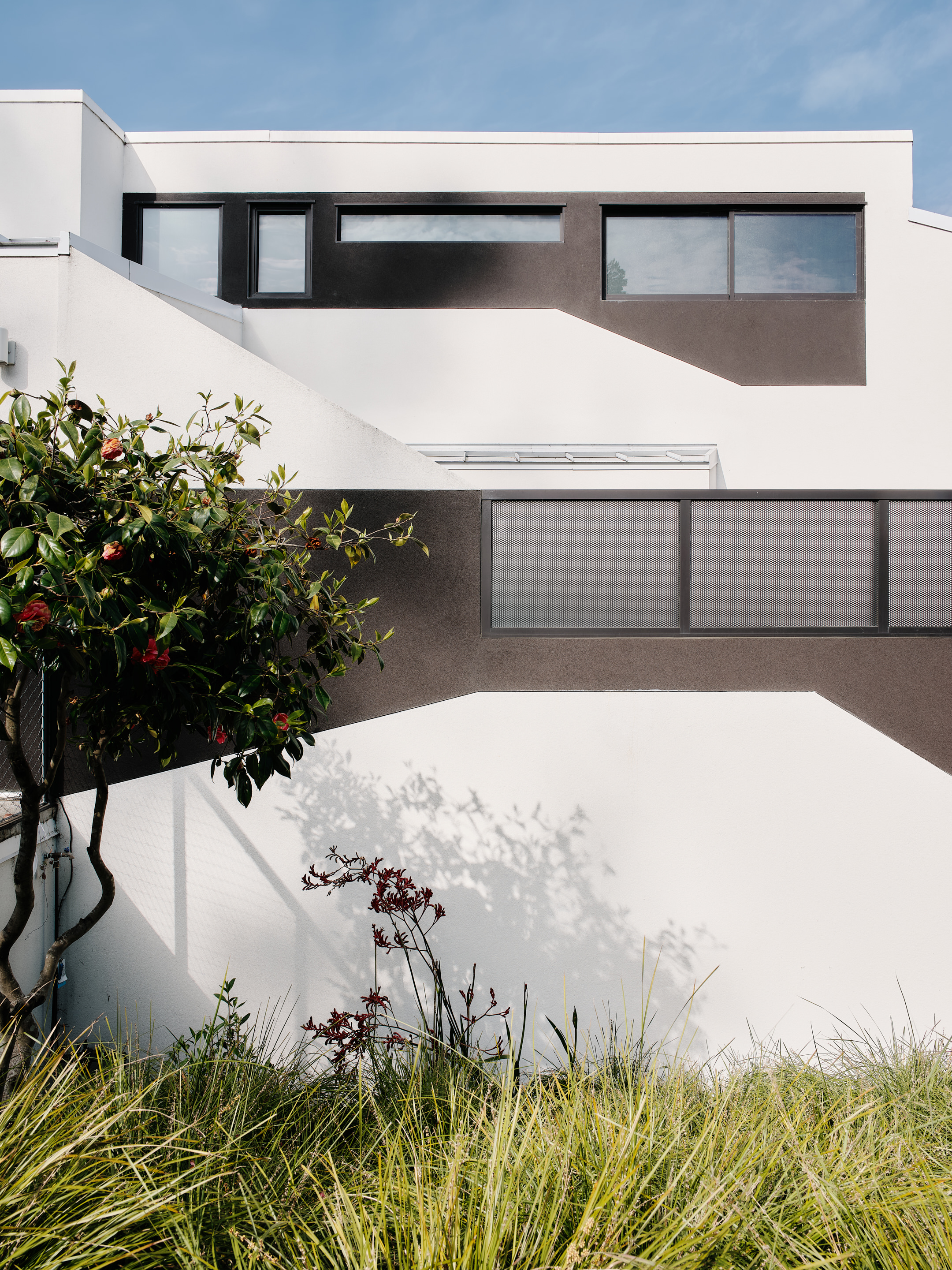 exterior detail of white volumes at Space Invader house