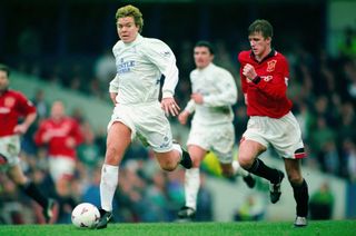 Tomas Brolin on the ball for Leeds United against Manchester United in December 1995 as David Beckham gives chase.