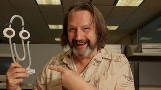 Clippy creator Kevan Atteberry poses with a big ol' paperclip