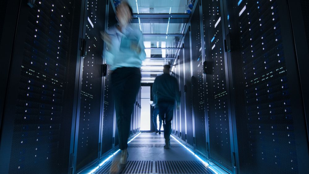 Man walking through data centre