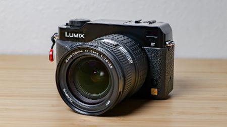 A photo of the Lumix L1 DSLR on a wooden surface
