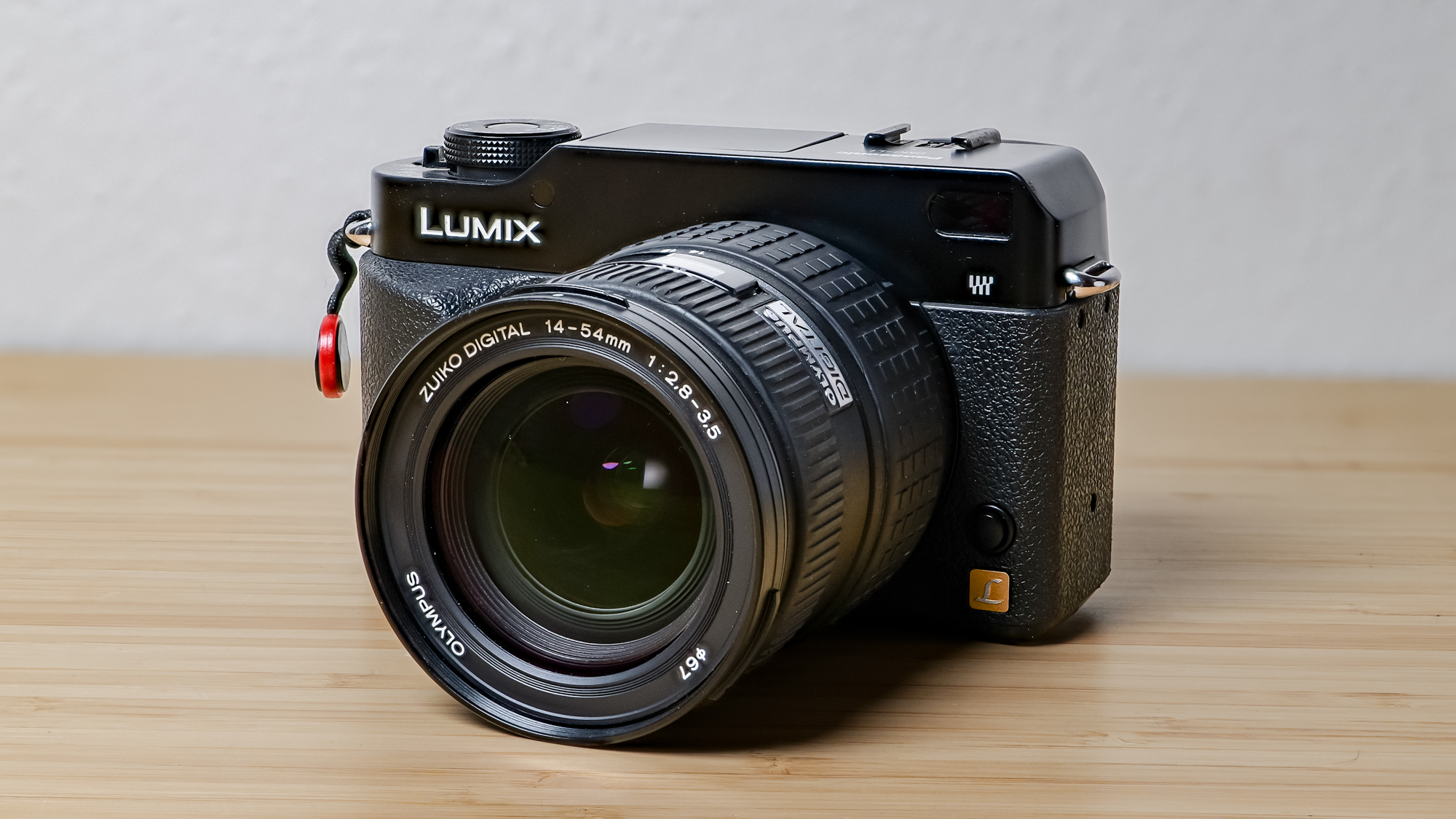 A photo of the Lumix L1 DSLR on a wooden surface