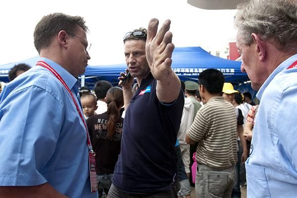 Skil-Shimano team-manager, Rudi Kemna, explains the situation when Kenny Van Hummel punctured to Chief Commissaire Alexander Donike (left) as Martijn Swinkels looks on.