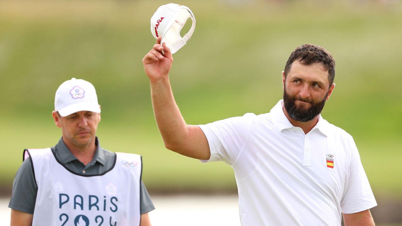 Jon Rahm with his hat off to the fans after shooting a five-under-par round to joint-lead the Olympics golf event after 54 holes