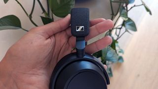 Close-up of the Sennheiser Momemtum 4 Wireless in hand