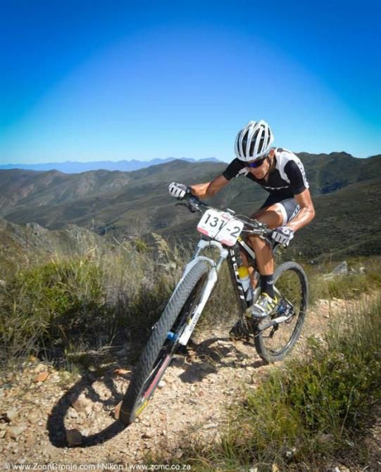 Scott Factory Racing's Philip Buys approaches the summit of a steep climb on his way through the Kammanassie Mountains in stage 4