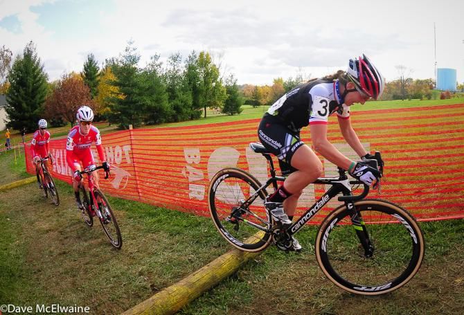 Kaitie Antonneau (Cannondale/Cyclocrossworld.com) riding the log steps ahead of the Cal Giant women