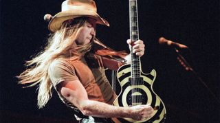 Zakk Wylde performs live on stage, playing his Gibson Les Paul Custom bullseye guitar. 26th June 1994. Gibson guitars celebrate their 100th anniversary with the concert "Night of 100 Guitars", at Wembley Arena