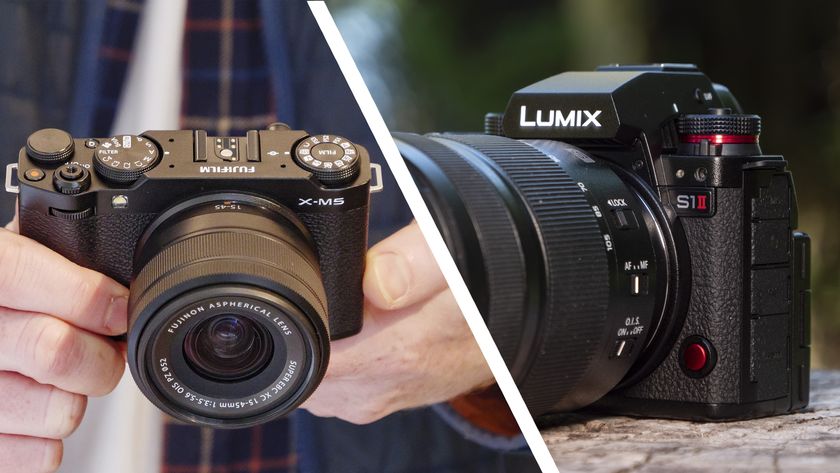 Fujifilm X-M5 in user&#039;s hands, Panasonic Lumix S1 II on a wooden surface outdoors