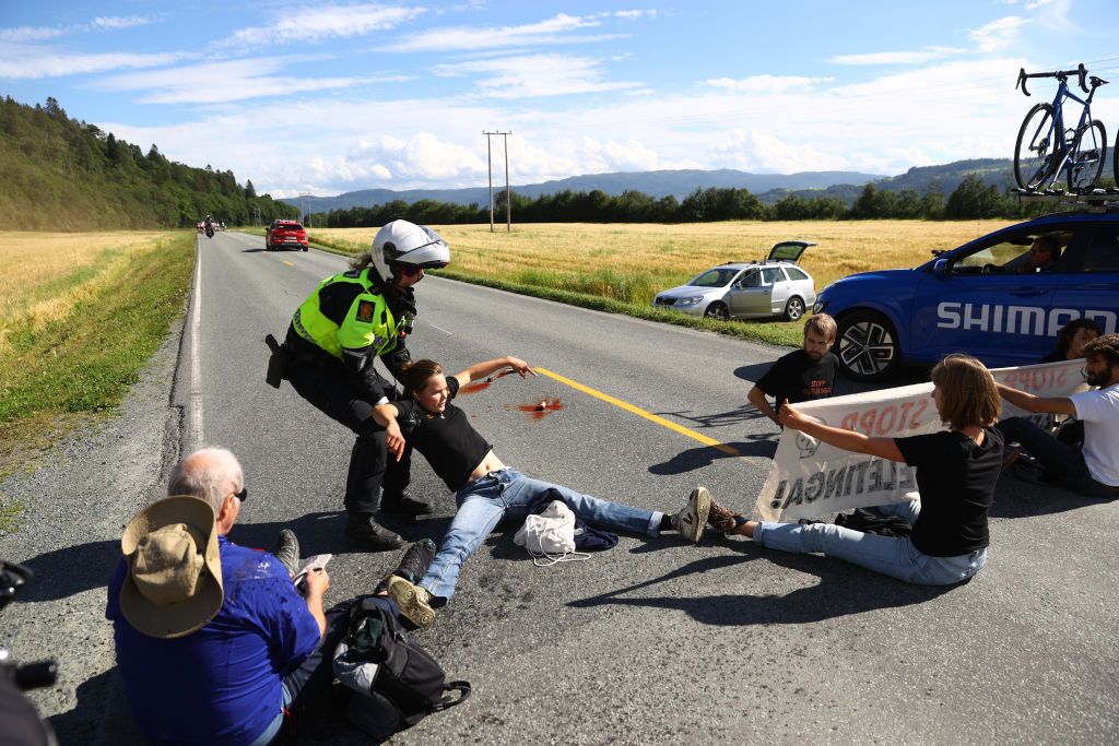 TRONDHEIM NORWAY AUGUST 14 Protesters block the race during the 9th Arctic Race Of Norway 2022 Stage 4 a 1591km stage from Trondheim to Trondheim ArcticRace on August 14 2022 in Trondheim Norway Photo by Michael SteeleGetty Images
