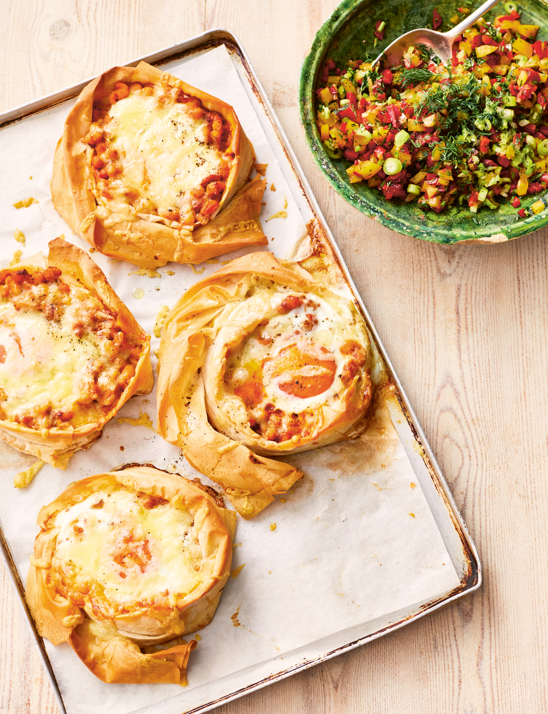 A tray of filo pastries filled with beans, cheese and egg