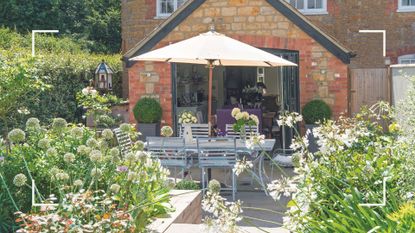 Sunny summer garden with back doors open to the house onto a dining atbelw ith parasol to support expert tips on how to avoid sunburnt plants