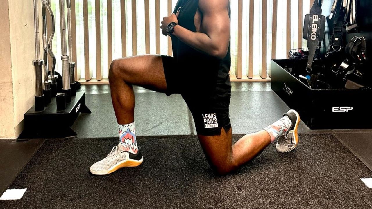 Person trainer Lewis Paris performs a lunge