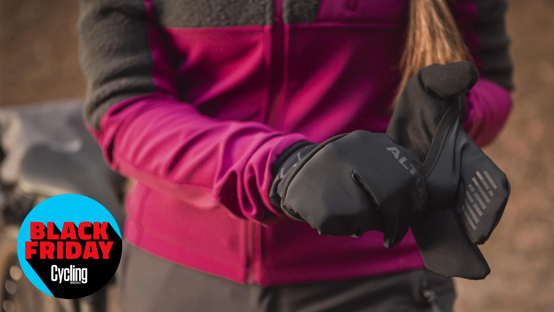 Woman putting on Altura allroad adapt winter cycling gloves
