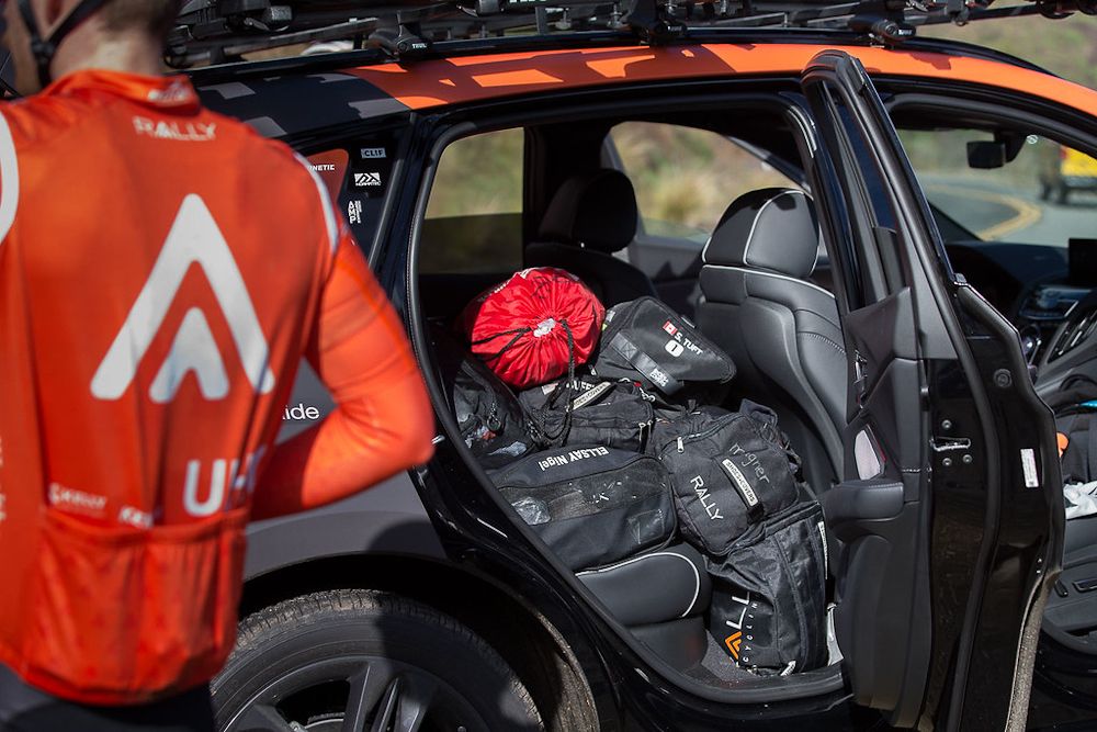 The Rally UHC team car is loaded with rain bags for a damp training day