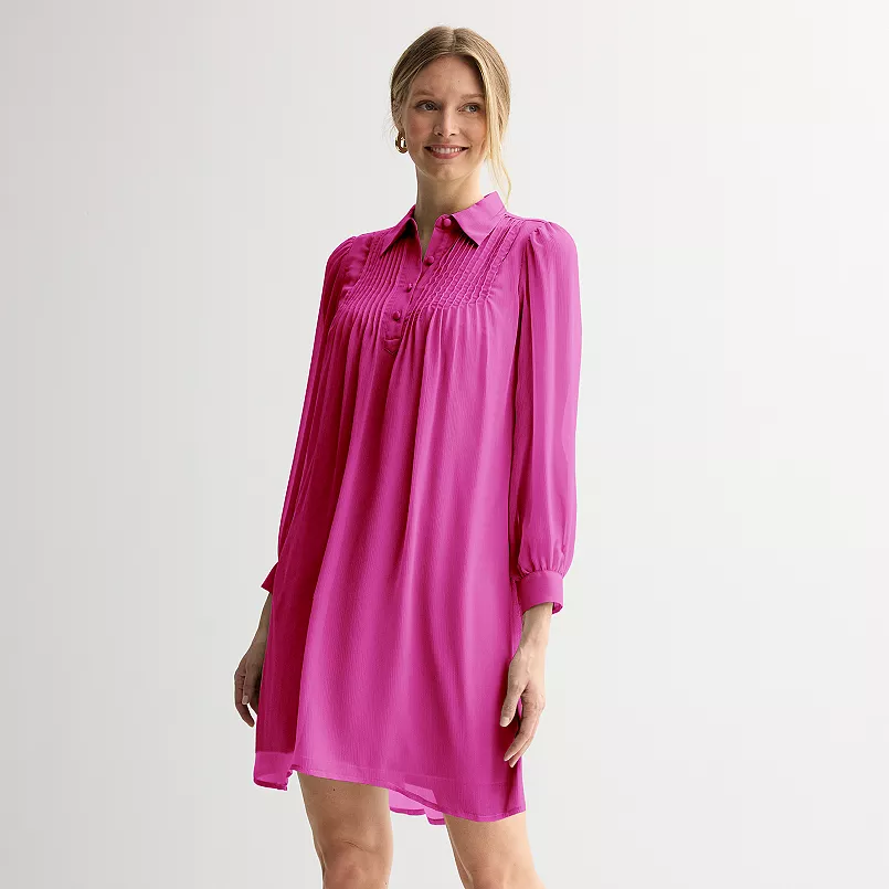 A pink swing dress on a model
