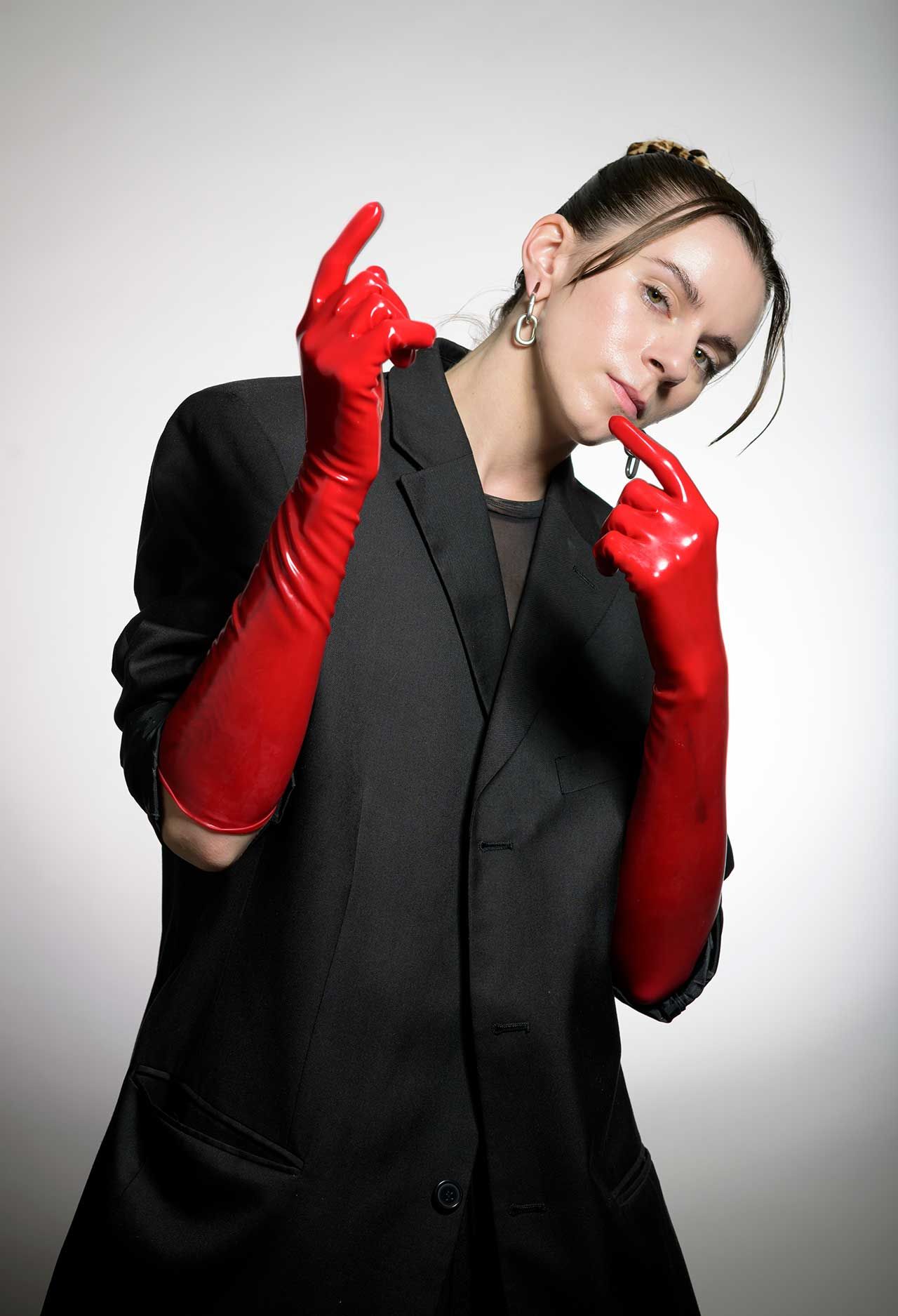 Lyndsey Gunnulfsen of the band Pvris poses for a portrait in red gloves