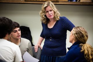 Kathleen Kramer, PhD, director of engineering programs and electrical engineering professor, listens to students during a class. Kramer, along with two engineering colleagues, received an NSF grant to help recruit military veterans to USD.