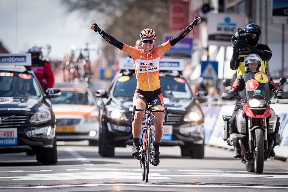 Chantal Blaak celebrates as she crosses the finish line at Gent-Wevelgem