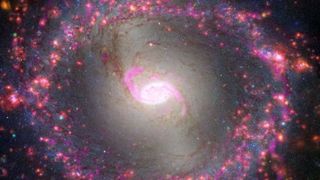 A spiral galaxy with a bright bar structure in its center.