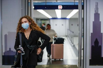 A woman arrives at O'Hare Airport in Chicago.