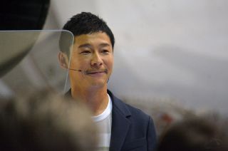 Japanese billionaire Yusaku Maezawa, shown here at an event announcing his plan to fly around the moon on SpaceX's Starship vehicle, has booked a trip to the International Space Station on a Russian Soyuz spacecraft. Liftoff is scheduled for Dec. 8, 2021. 