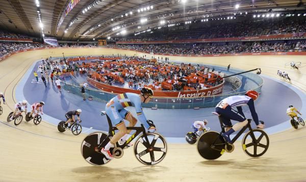 Edward Clancy (Great Britain) and Gijs van Hoecke (Belgium) ride high on the banking during the omnium's 30km points race.