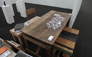 Wooden tables on a black carpet