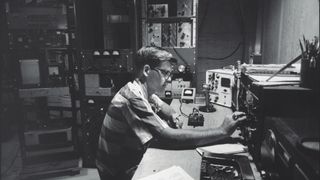 Ham radio operator Louis Breyfogle tuning in on message from satellite Echo I.