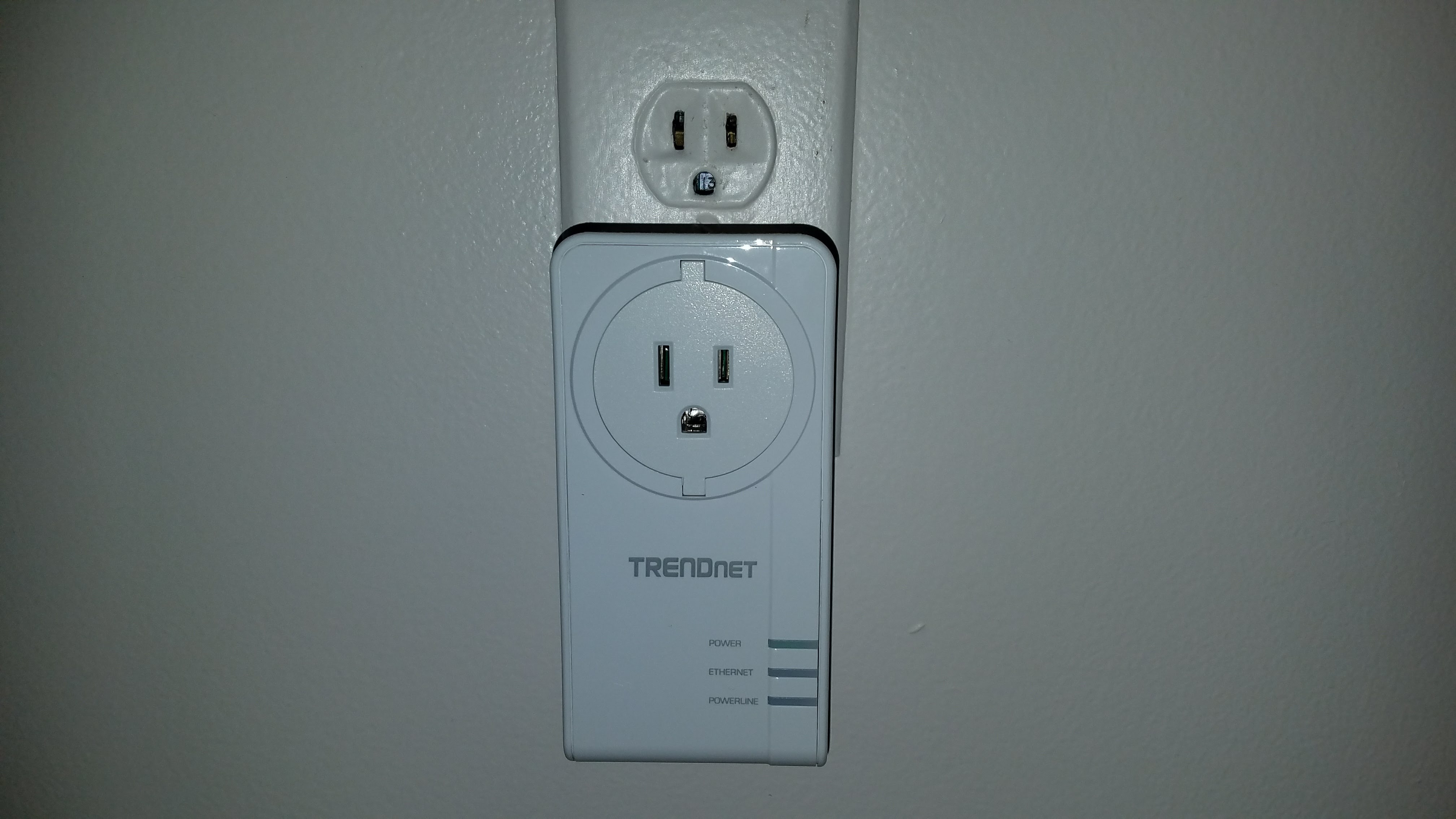 This Trendnet adapter allows access to the outlet above, and has a passthrough to the lower outlet as well.