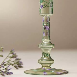 A green, hand-painted candlestick from Anthropologie