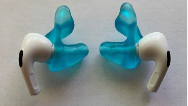 Blue Avery earpieces on AirPods Pro with white background