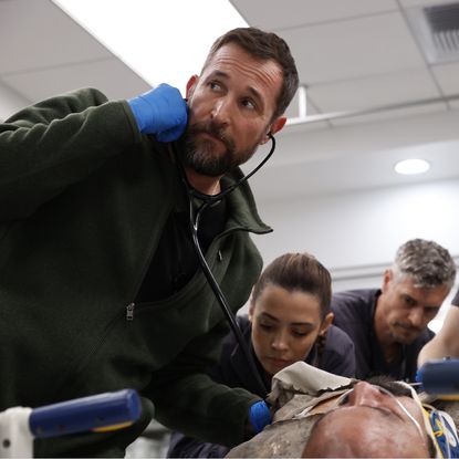 doctor robby and others try to resuscitate a patient in a still from the pitt season 2