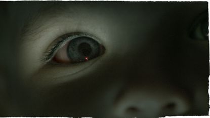 A close up of a child's eye that's blue. The image has a blue tint