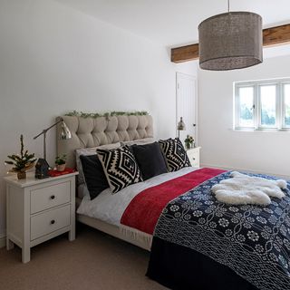 white bedroom with bed and carept floor