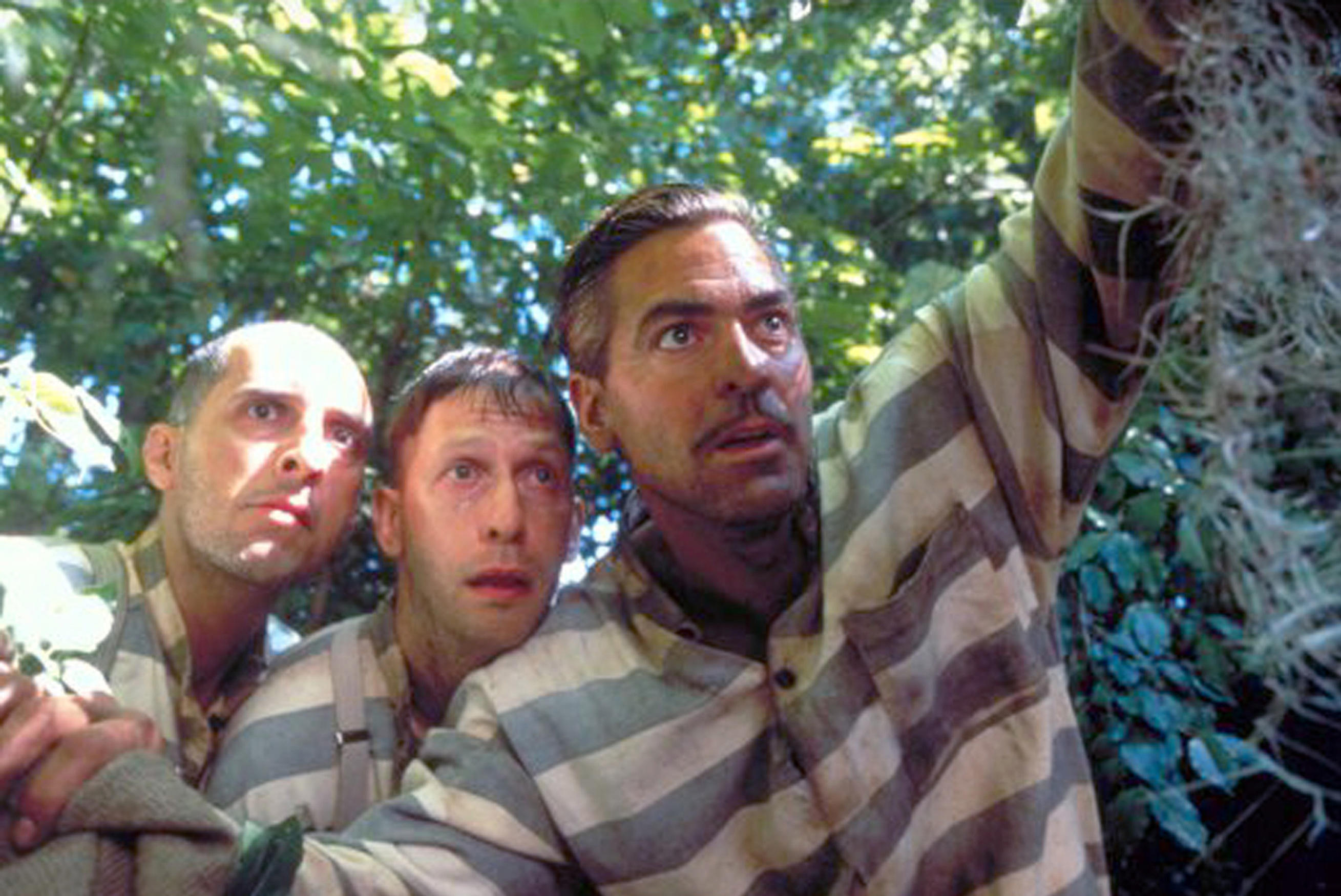John Turturro as Pete, Tim Blake Nelson as Delmar and George Clooney as Ulysses stare into the distance in O Brother, Where Art Thou?
